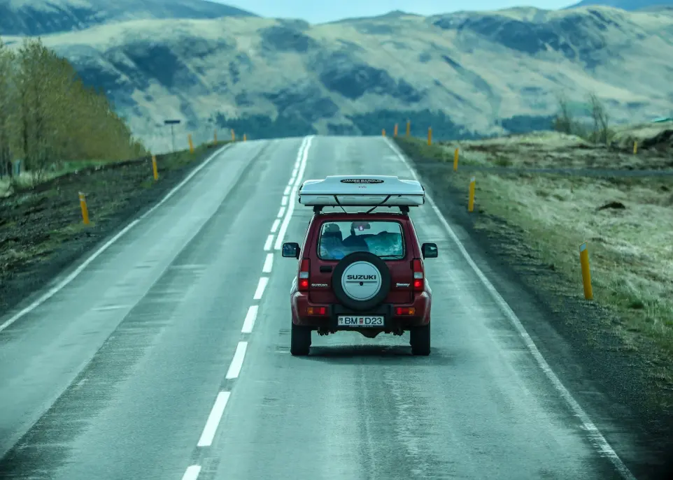 red car on road during daytime